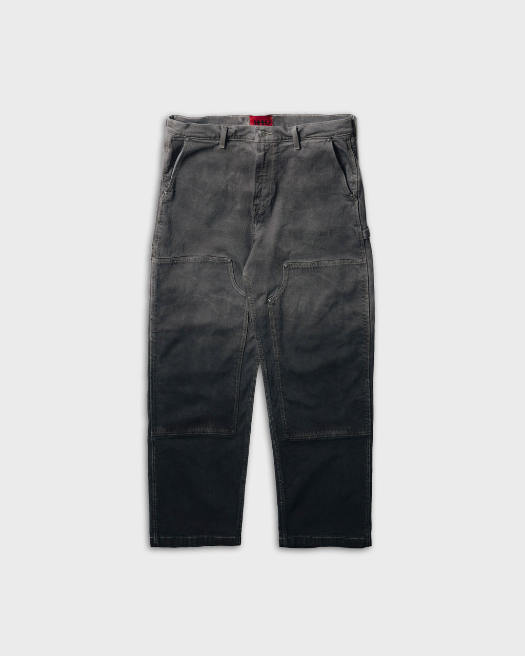 Dark gray pants on a light gray background